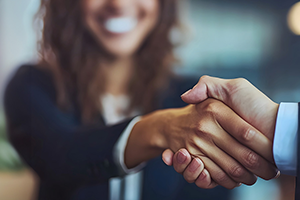women shaking hands
